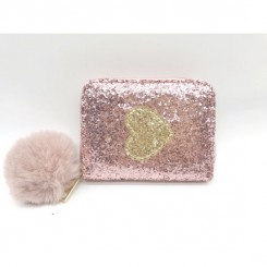 Pink pung med glitter og dekorativt hjerte.